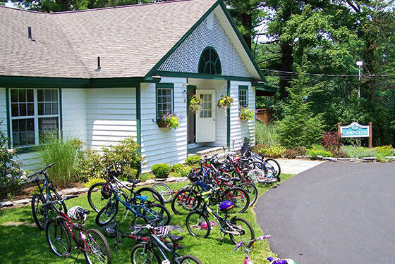 331 Summit Drive Cresco, PA 18326 - Photo 38 of 43 a front view of a house with a yard and flowers