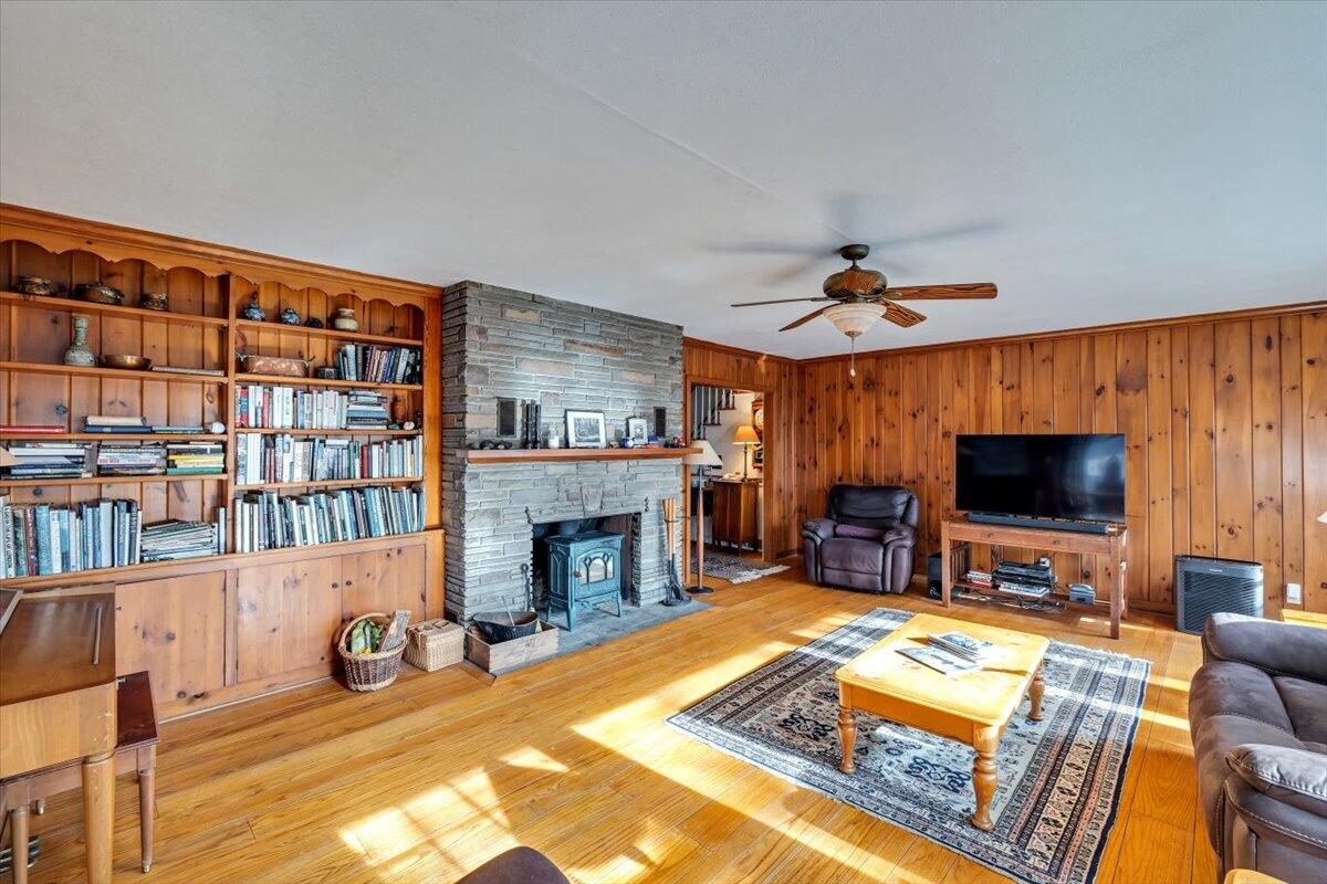 331 Summit Drive Cresco, PA 18326 - Photo 4 of 43 a living room with furniture a flat screen tv and a fireplace
