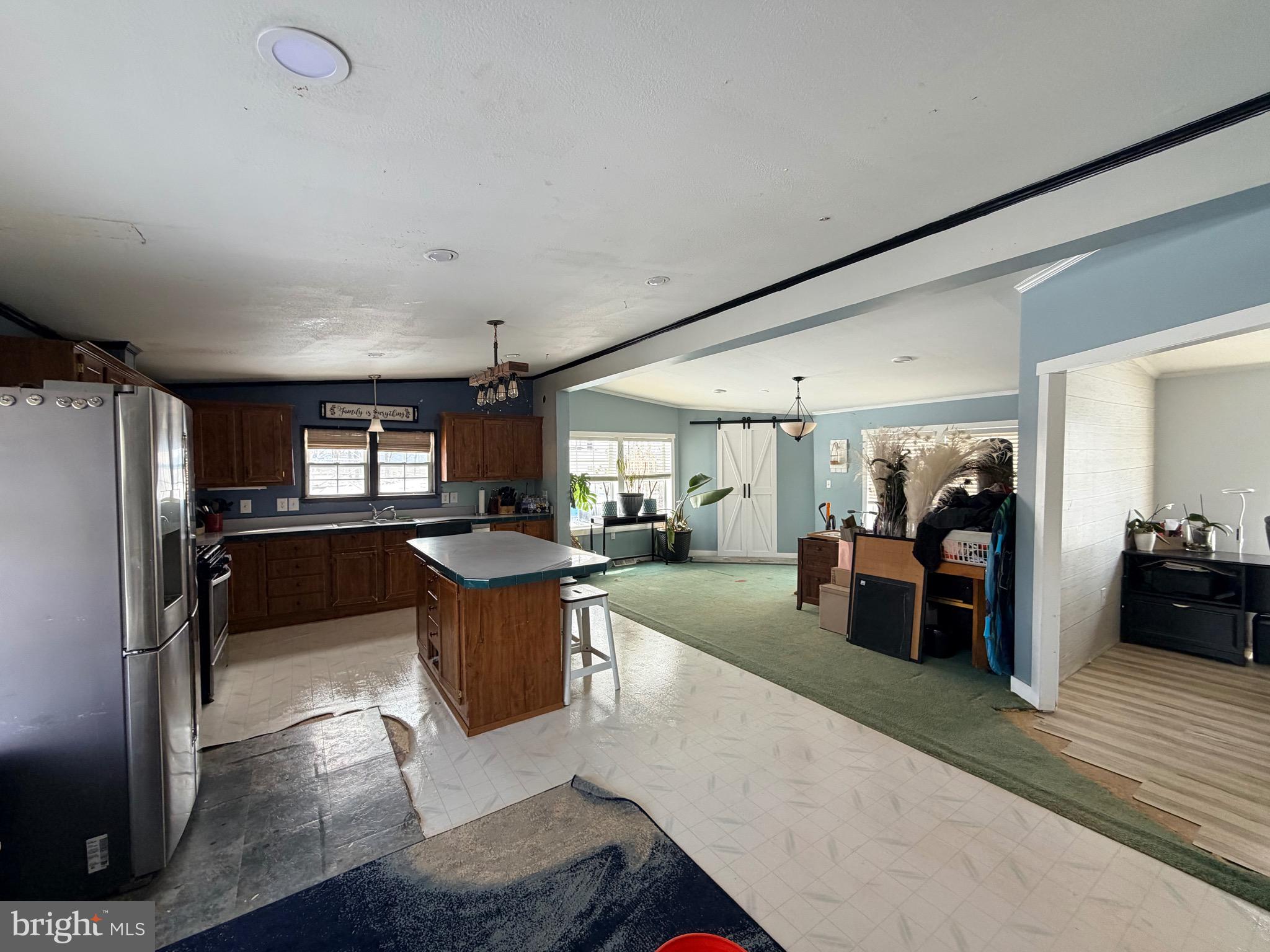 520 Wheeler School Road Whiteford, MD 21160 - Photo 11 of 37 a view of a living room kitchen and a sink