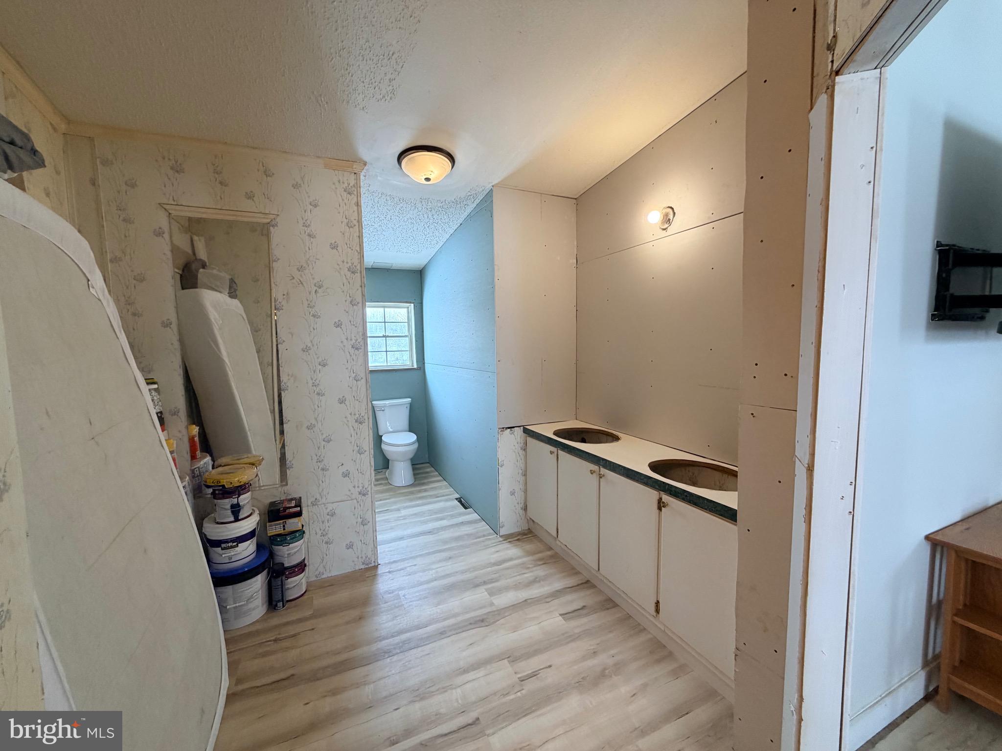520 Wheeler School Road Whiteford, MD 21160 - Photo 13 of 37 a view of a hallway with wooden floor and stairs