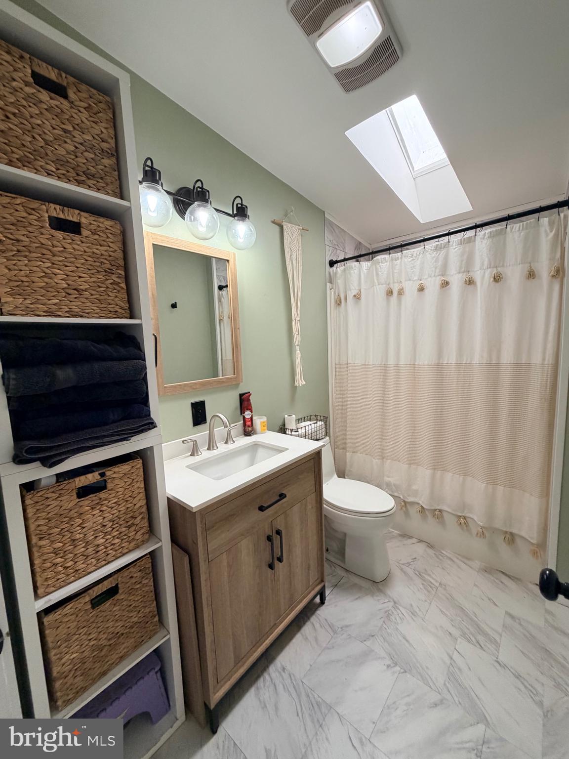 520 Wheeler School Road Whiteford, MD 21160 - Photo 22 of 37 a bathroom with a sink a toilet and shower