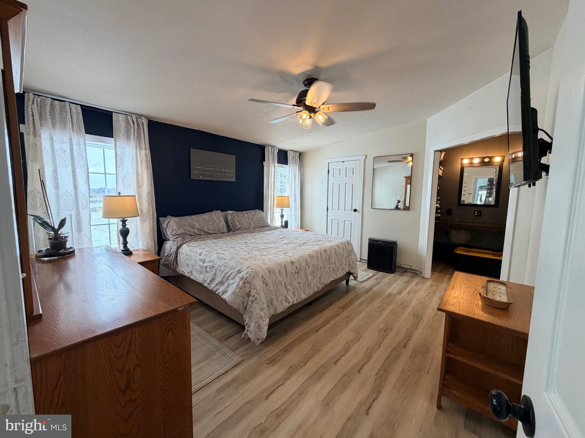 520 Wheeler School Road Whiteford, MD 21160 - Photo 23 of 37 a bedroom with a bed a desk and chair