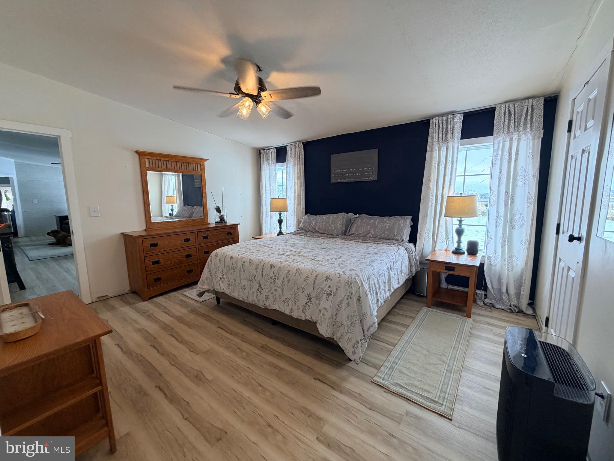 520 Wheeler School Road Whiteford, MD 21160 - Photo 24 of 37 a bedroom with a bed and a chandelier