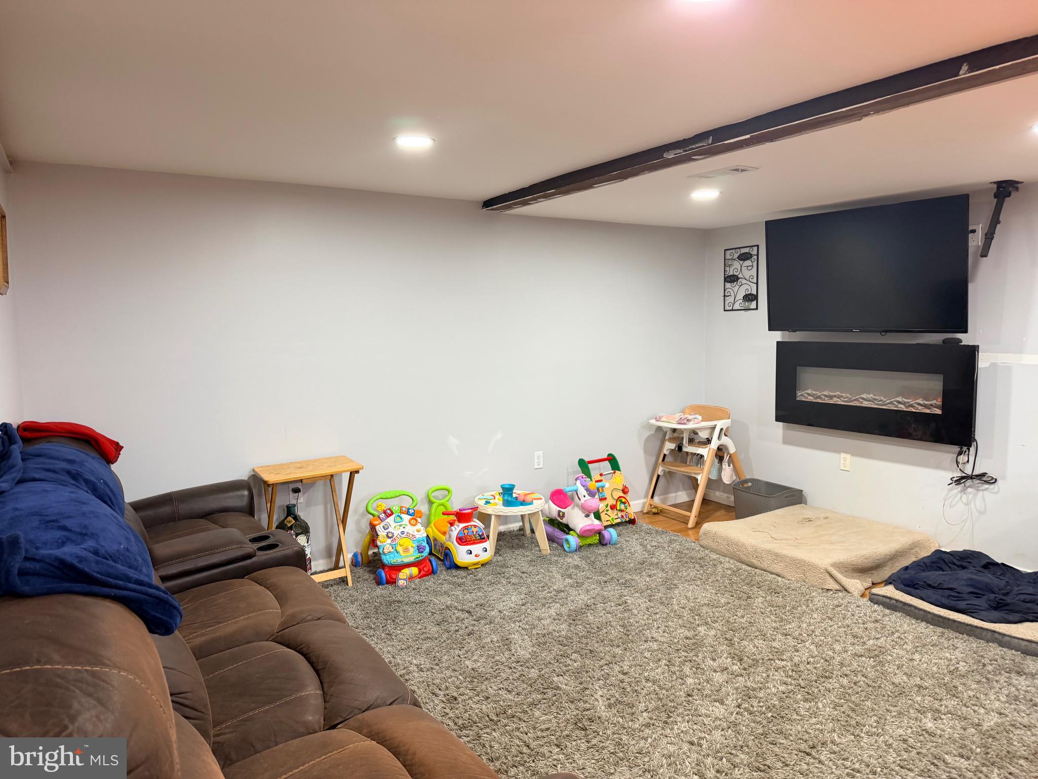 520 Wheeler School Road Whiteford, MD 21160 - Photo 29 of 37 a living room with furniture and a flat screen tv