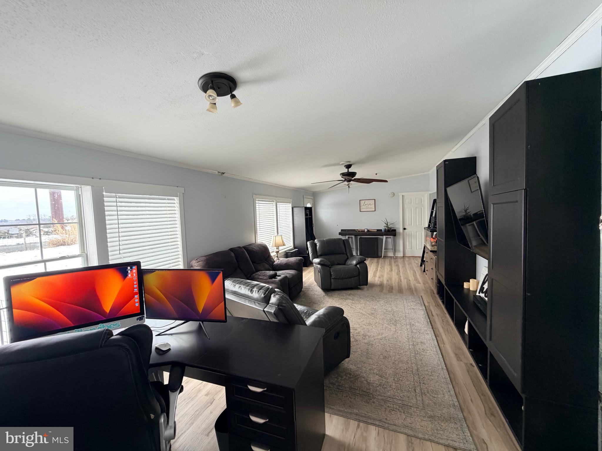 520 Wheeler School Road Whiteford, MD 21160 - Photo 3 of 37 a living room with furniture and a flat screen tv