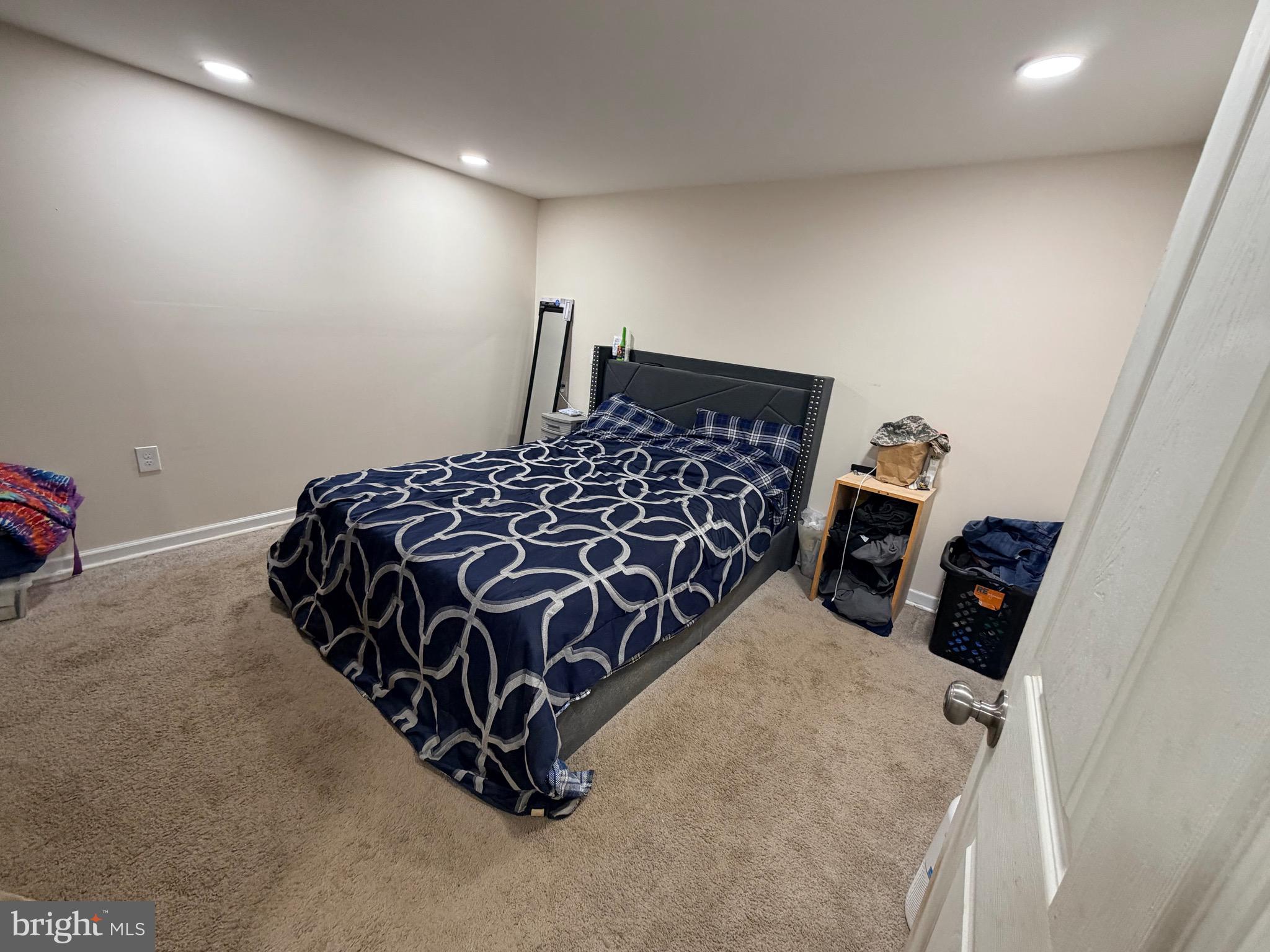 520 Wheeler School Road Whiteford, MD 21160 - Photo 32 of 37 a bed sitting in a bedroom next to a lamp