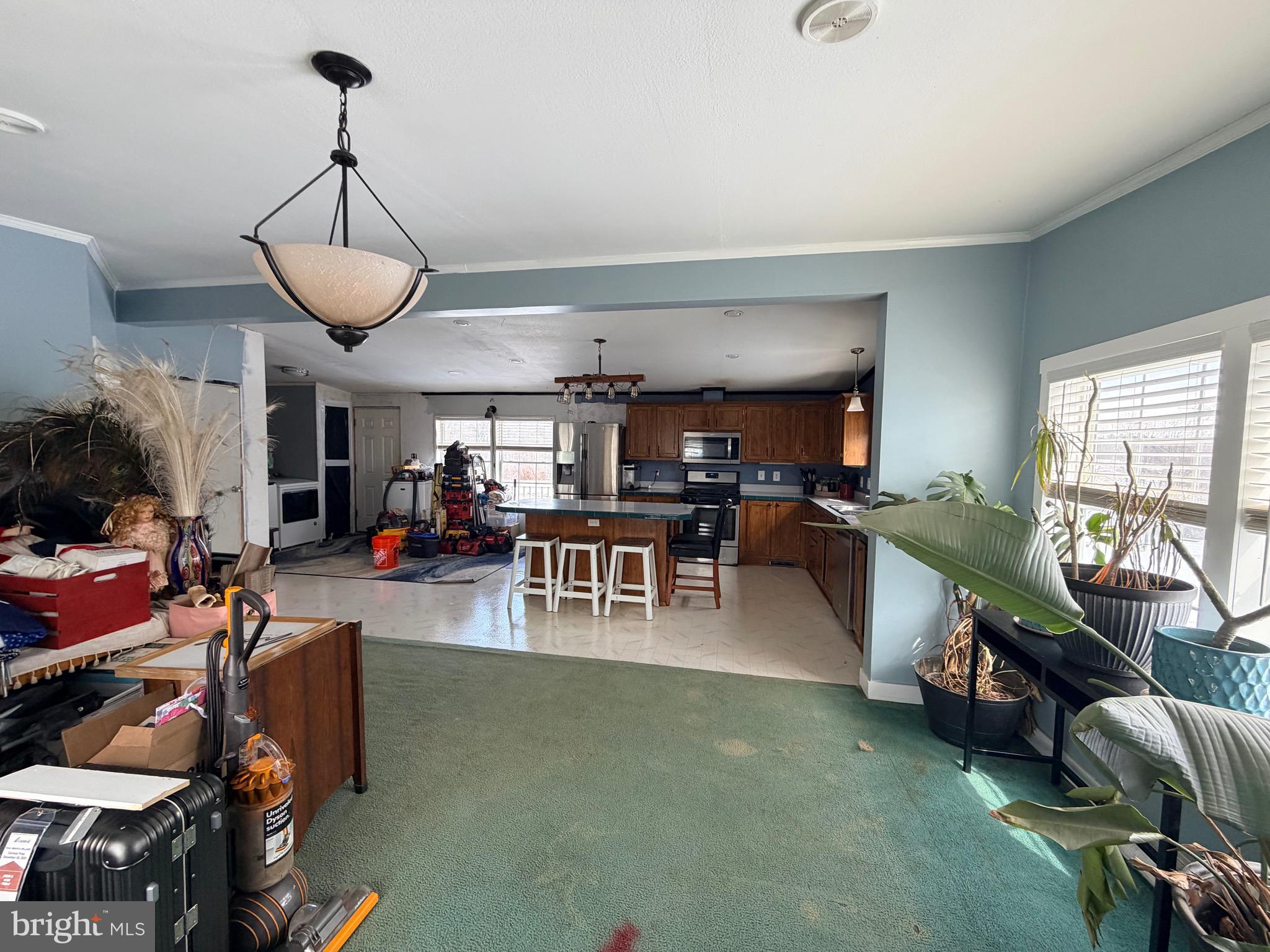 520 Wheeler School Road Whiteford, MD 21160 - Photo 8 of 37 a living room with lots of furniture and a chandelier