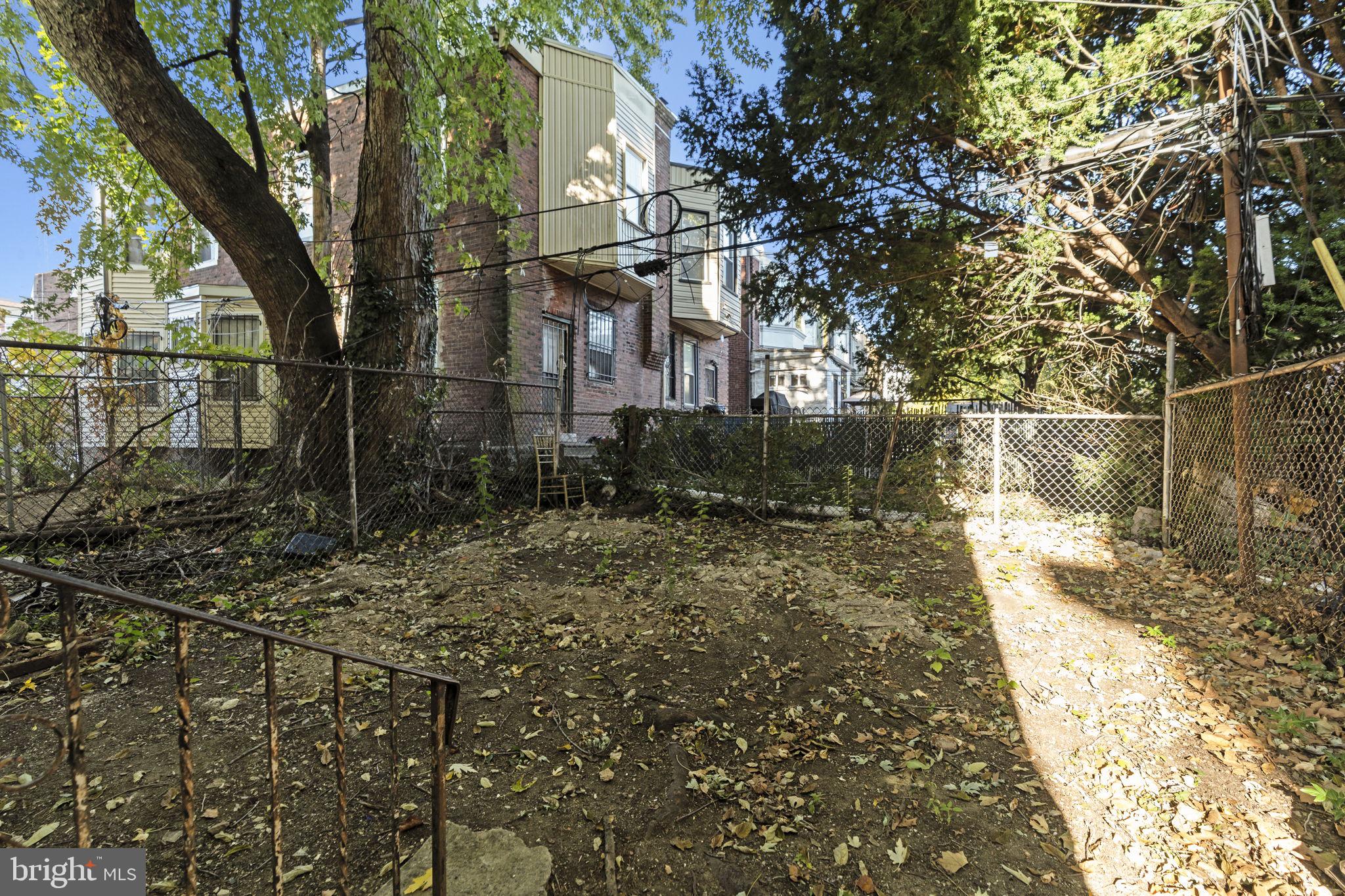 5237 Chester Avenue, Unit 2 Philadelphia, PA 19143 - Photo 15 of 40 a view of a brick house with a yard