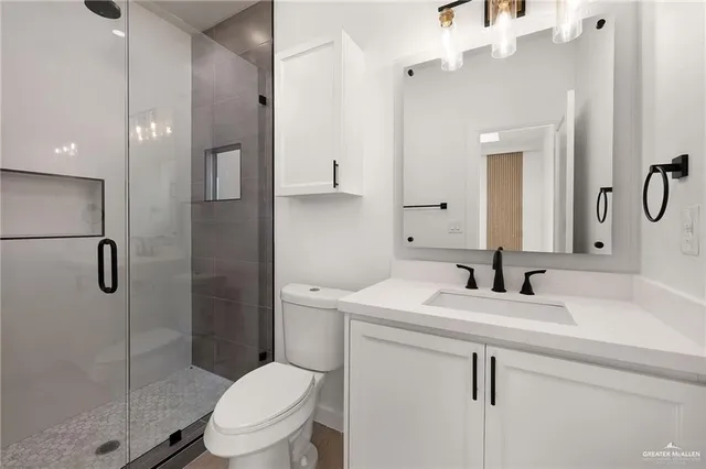 a bathroom with double sink and a mirror