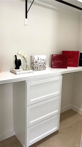 a view of an empty room with a fan