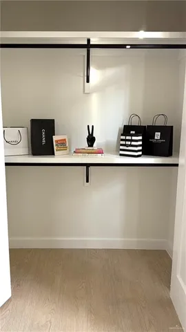a bathroom with a sink vanity mirror and toilet