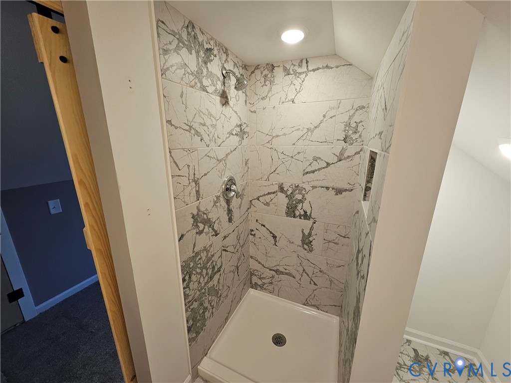 47 Ridge Road Blackstone, VA 23824 - Photo 22 of 23 a bathroom with a shower and a mirror