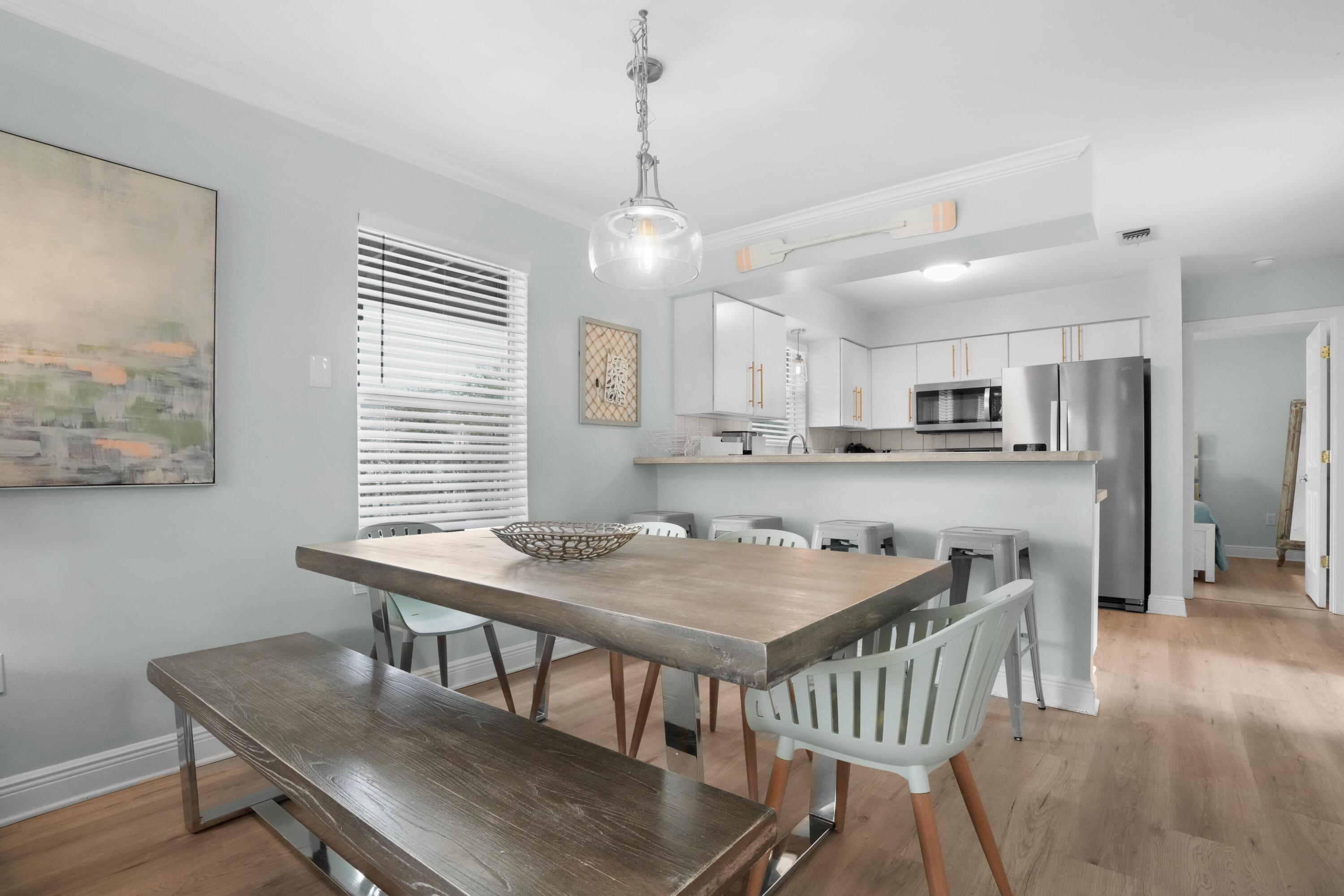 12 Windancer Lane Miramar Beach, FL 32550 - Photo 14 of 42 a view of a dining room with furniture window and wooden floor