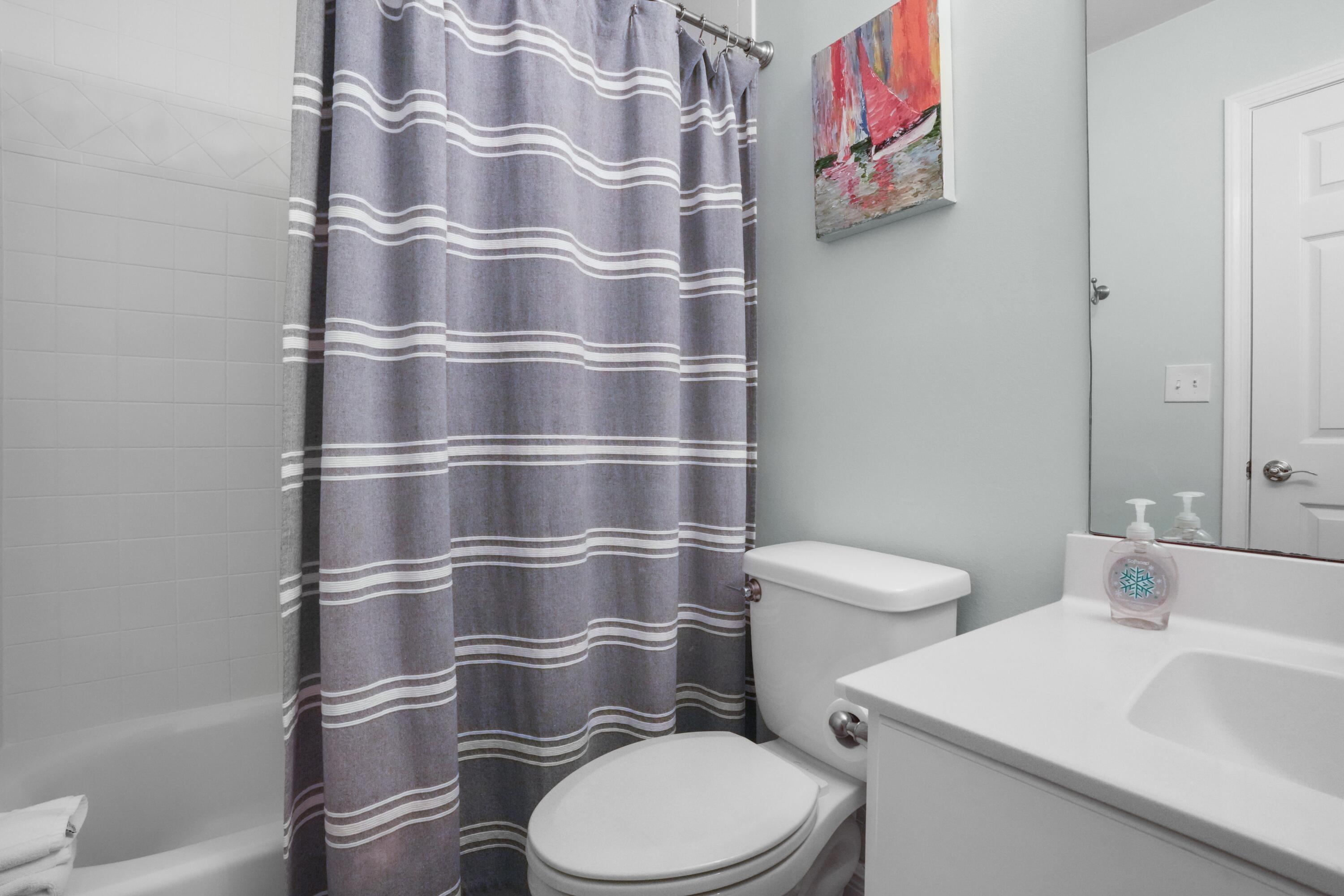 12 Windancer Lane Miramar Beach, FL 32550 - Photo 19 of 42 a white toilet sitting next to a bathroom sink