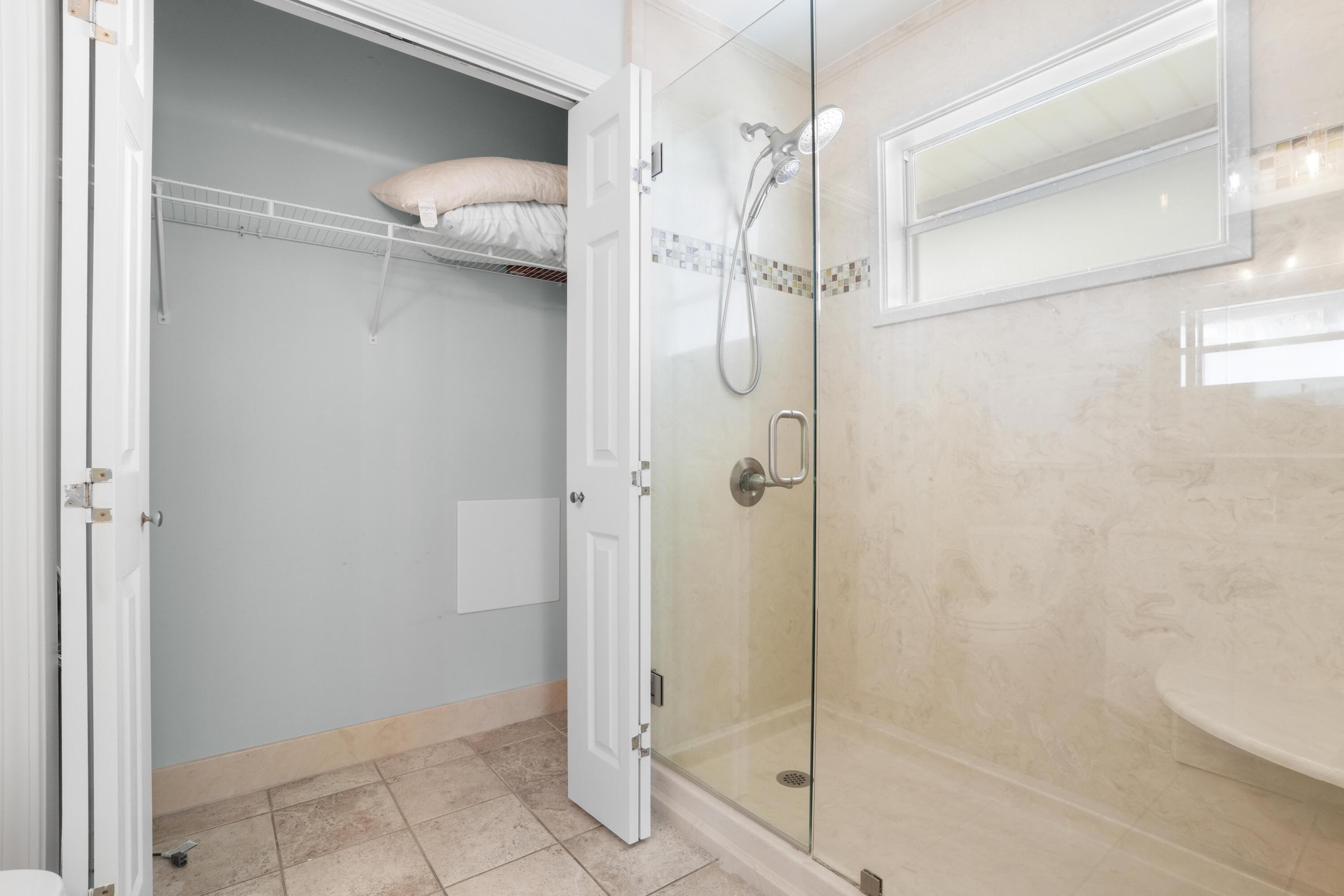 12 Windancer Lane Miramar Beach, FL 32550 - Photo 28 of 42 a bathroom with a glass shower door