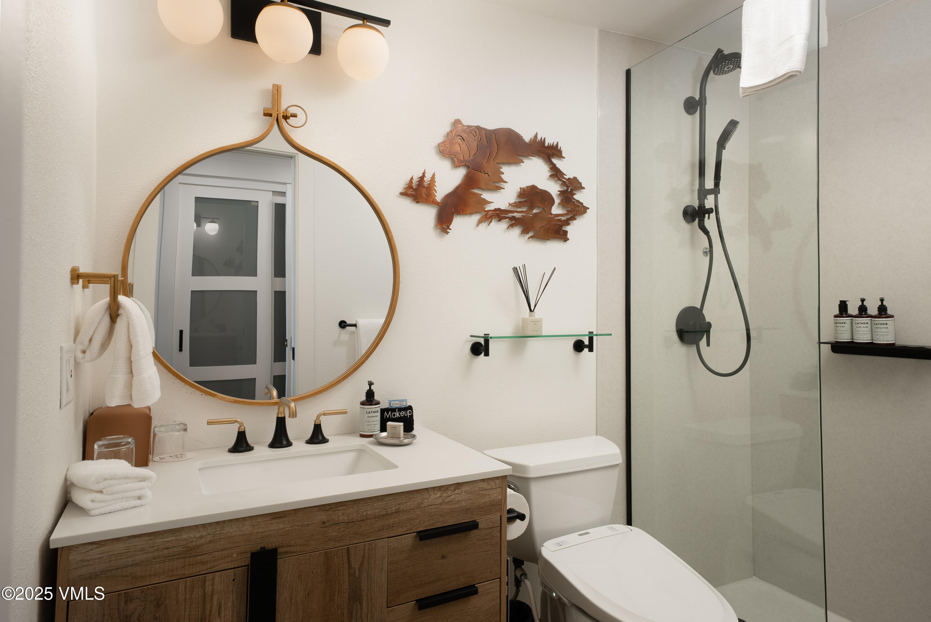 120 Willow Bridge Road, Unit 2H Vail, CO 81657 - Photo 8 of 15 a bathroom with a sink vanity mirror and toilet