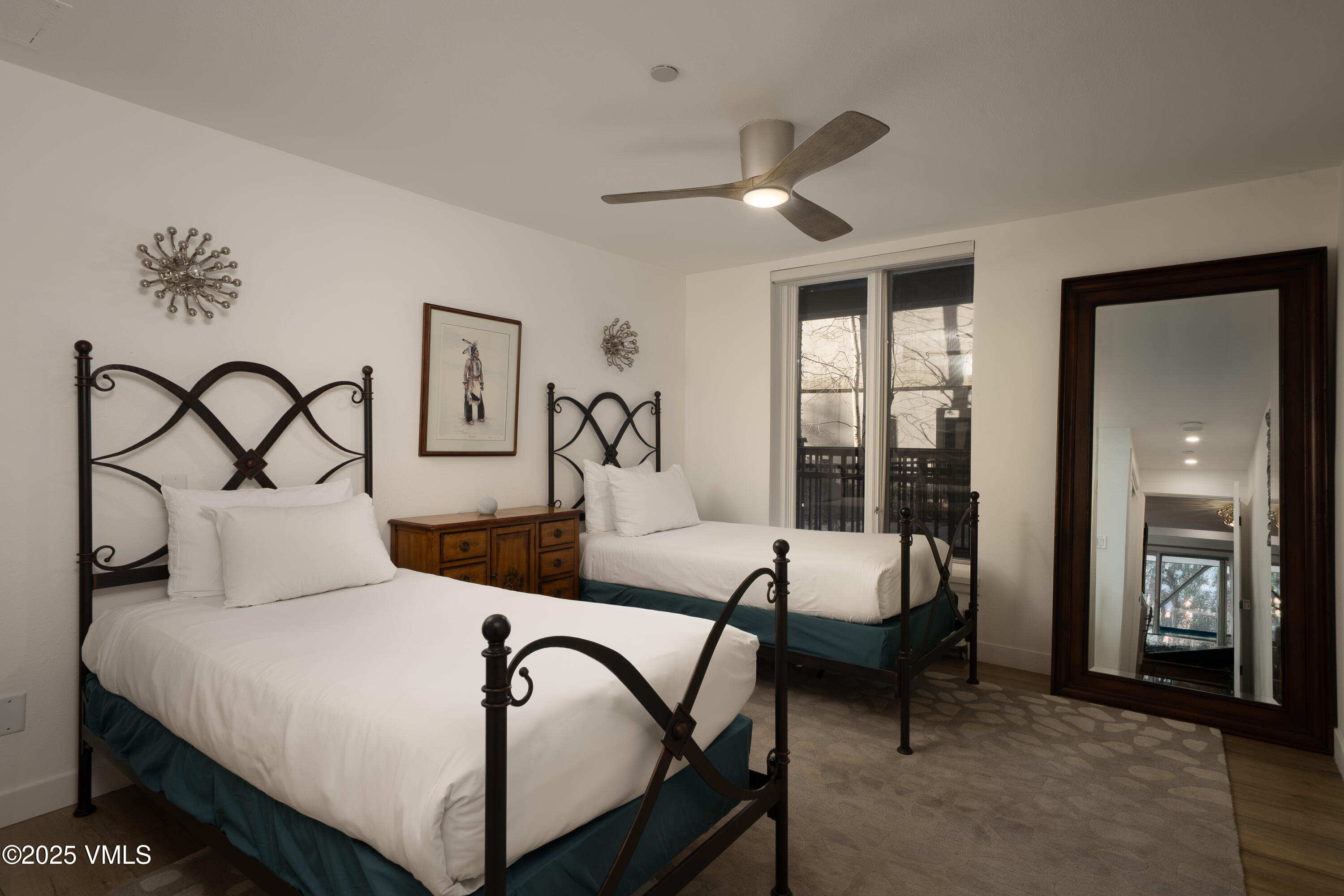 120 Willow Bridge Road, Unit 2H Vail, CO 81657 - Photo 10 of 15 a bedroom with a bed and a table