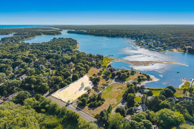a view of a lake with a yard