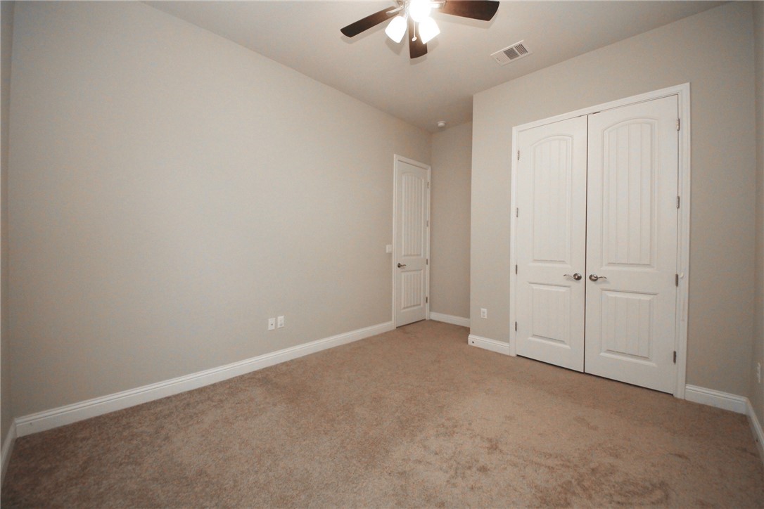 15800 Jeffs Lane Austin, TX 78717 - Photo 12 of 17 an empty room with a chandelier fan