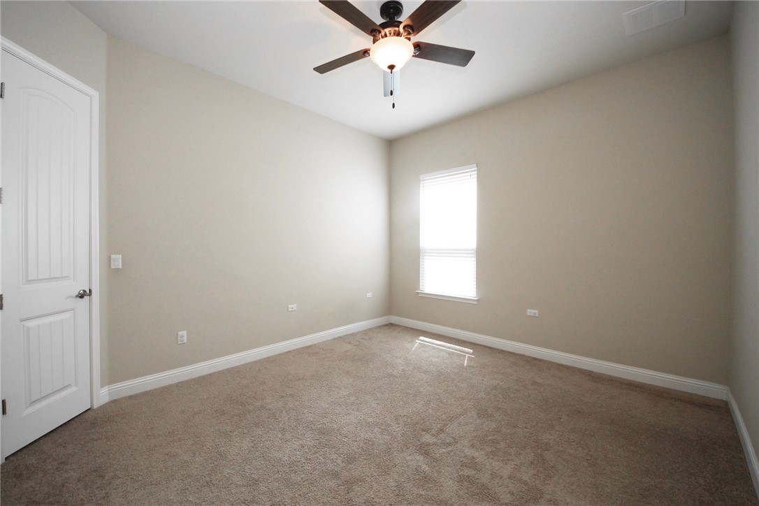 15800 Jeffs Lane Austin, TX 78717 - Photo 10 of 17 an empty room with windows and fan