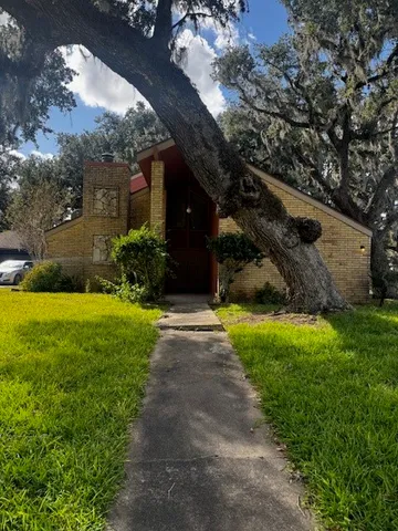 a view of a house with a yard