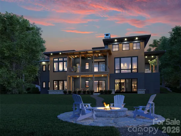 a front view of a residential apartment building with a yard