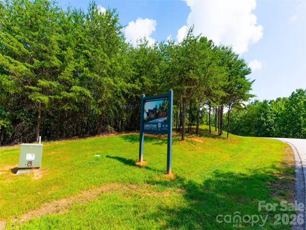 a view of a backyard with swimming pool