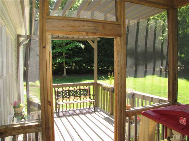 12101 Old Creedmoor Road Raleigh, NC 27613 - Photo 20 of 25 a view of a room with balcony and wooden floor