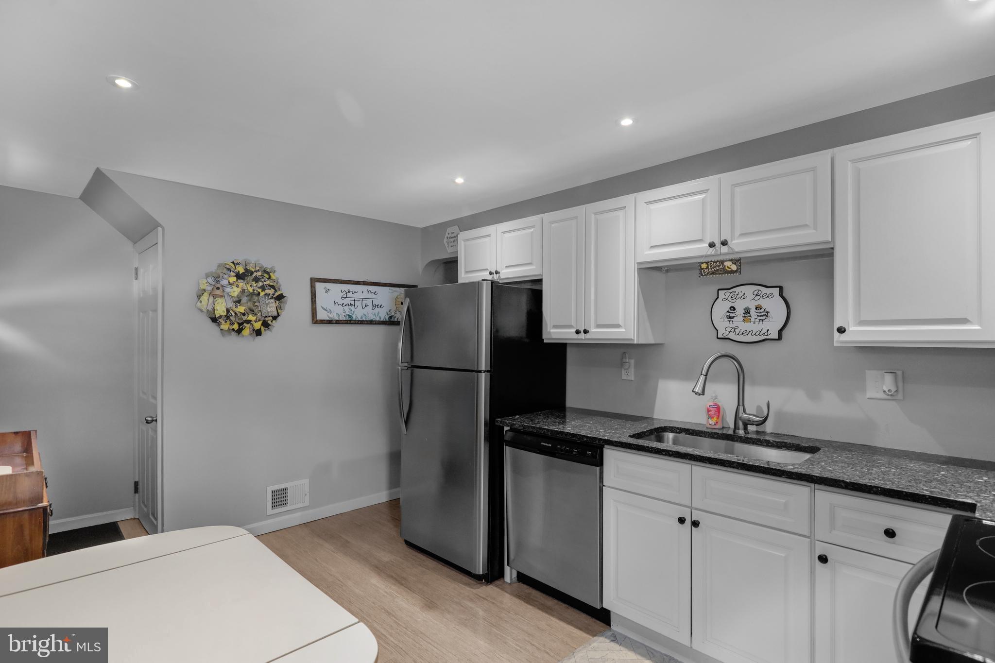 135 Chestnut Street Shillington, PA 19607 - Photo 11 of 34 a kitchen with stainless steel appliances granite countertop a refrigerator and a sink