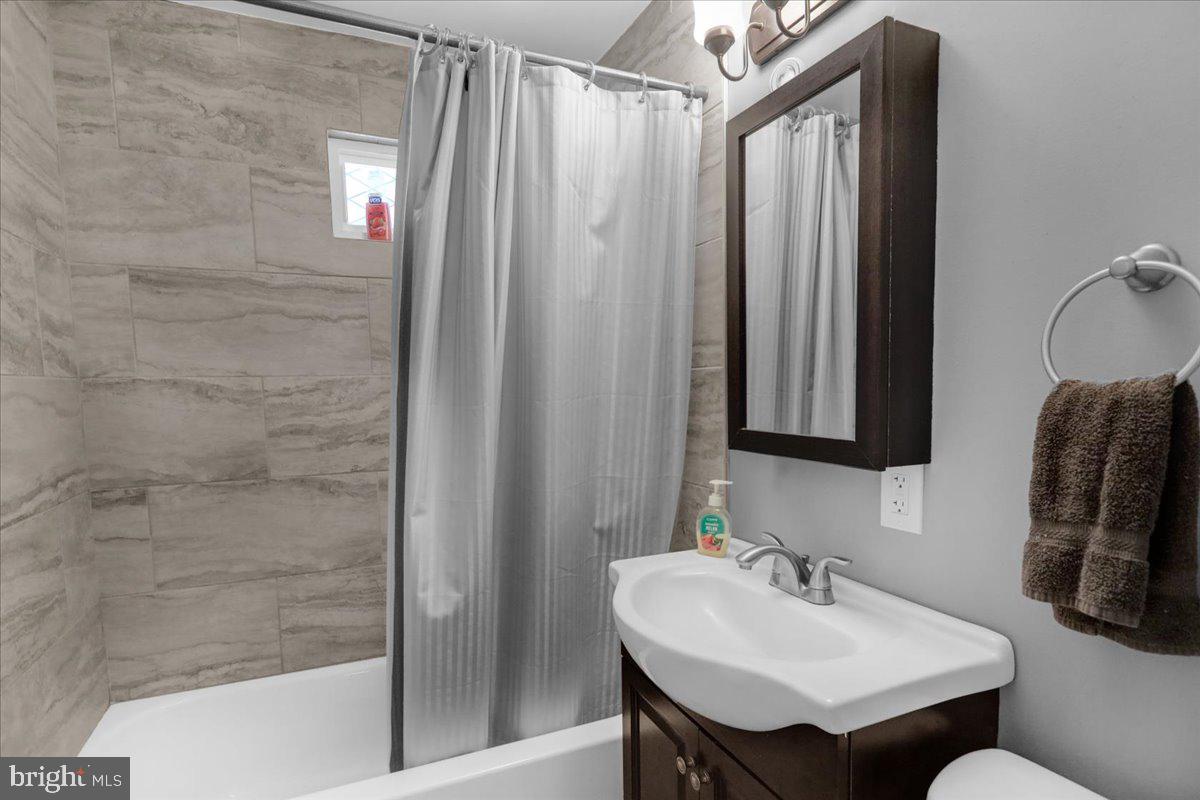 135 Chestnut Street Shillington, PA 19607 - Photo 12 of 34 a bathroom with a sink and a mirror