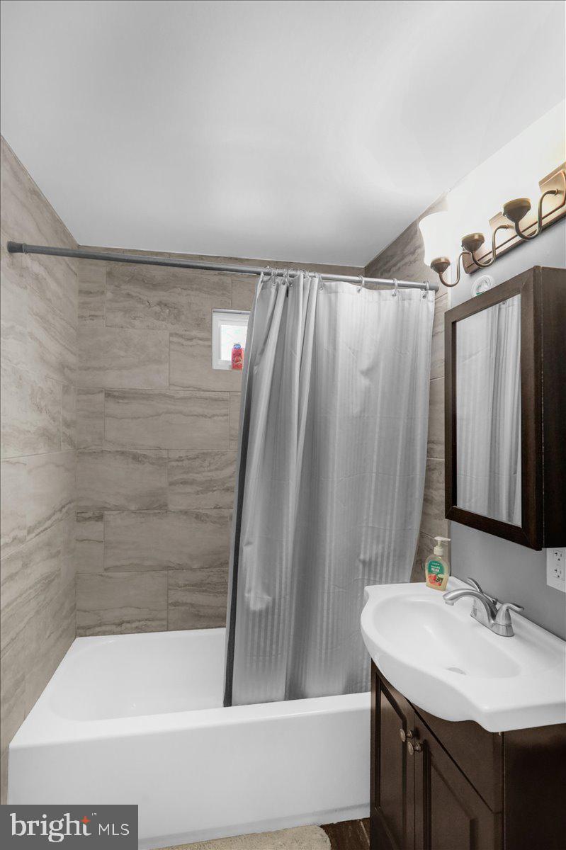 135 Chestnut Street Shillington, PA 19607 - Photo 13 of 34 a bathroom with a sink and a mirror