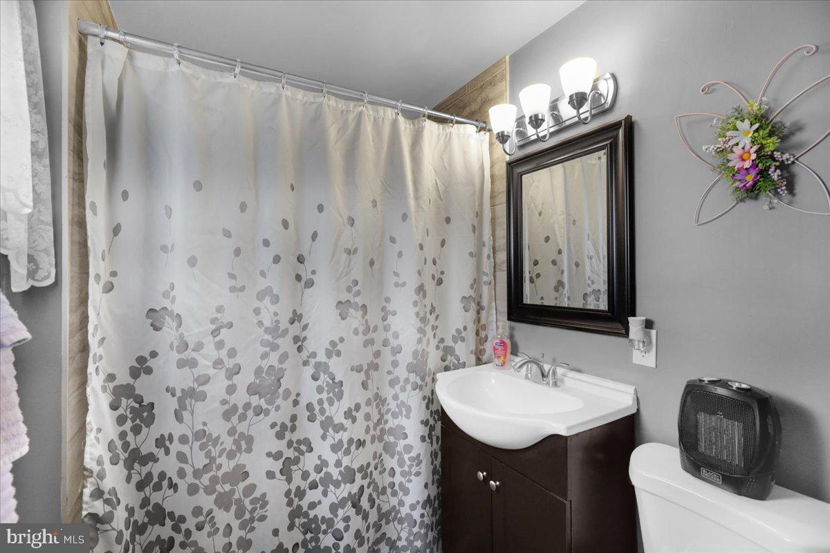 135 Chestnut Street Shillington, PA 19607 - Photo 16 of 34 a bathroom with a sink vanity and a mirror