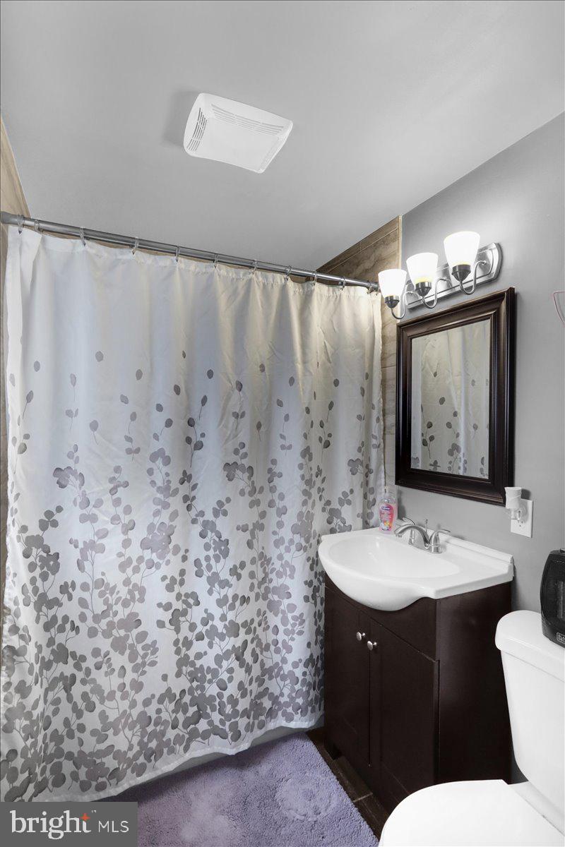 135 Chestnut Street Shillington, PA 19607 - Photo 17 of 34 a bathroom with a sink and a mirror