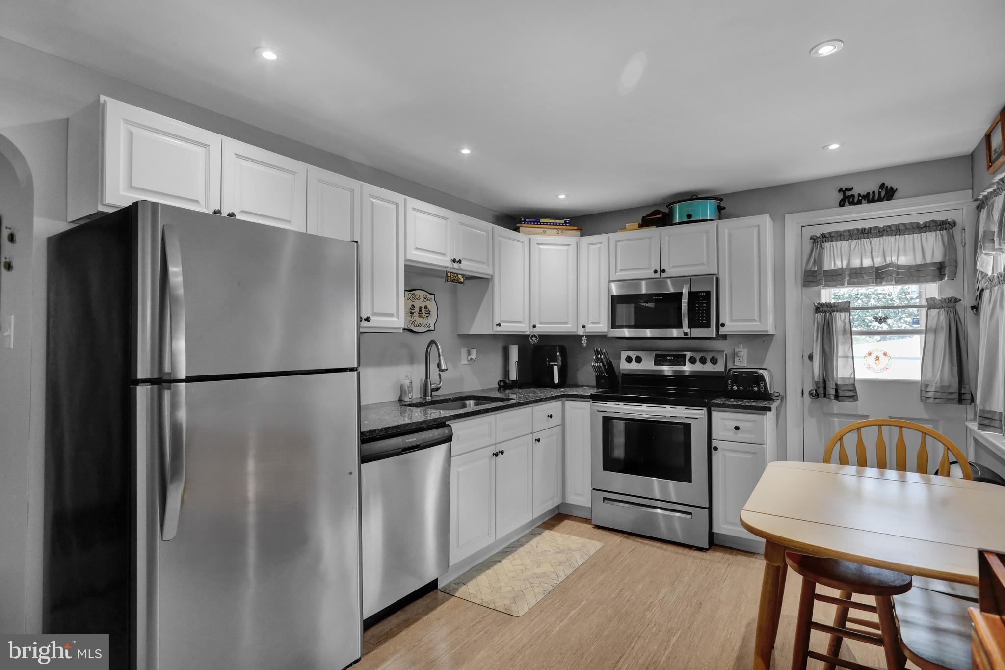 135 Chestnut Street Shillington, PA 19607 - Photo 9 of 34 a kitchen with stainless steel appliances granite countertop a refrigerator and a stove top oven