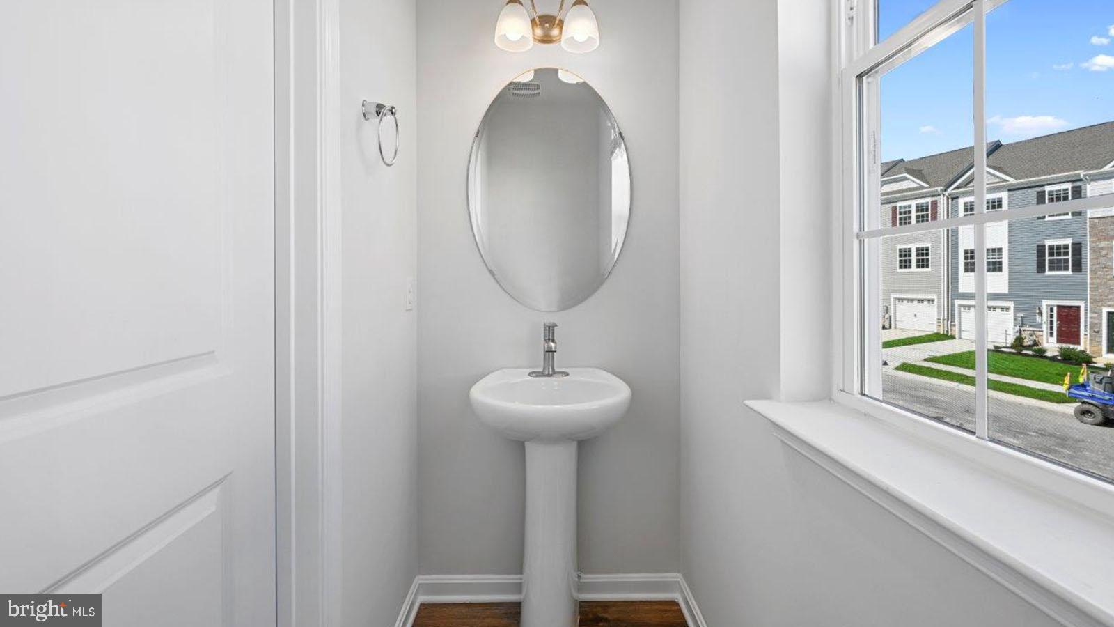 7505 Silver Thread Way Brandywine, MD 20613 - Photo 17 of 24 a bathroom with a sink and a mirror