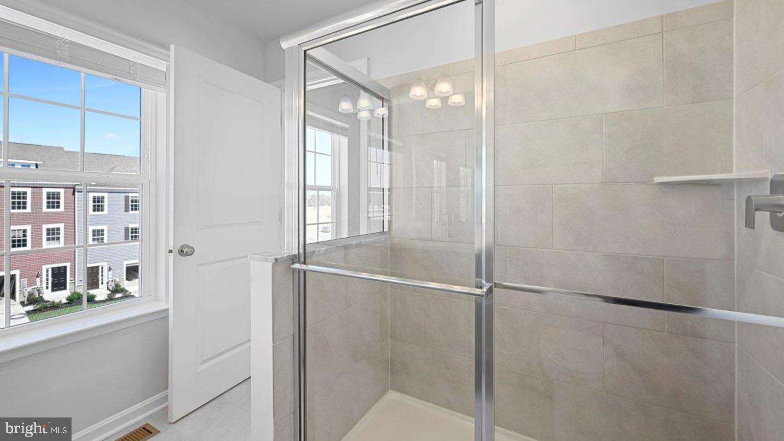 7505 Silver Thread Way Brandywine, MD 20613 - Photo 23 of 24 a bathroom with a glass shower door