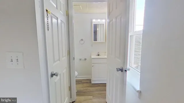 a view of a bathroom from a hallway