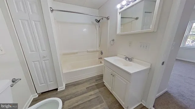 a bathroom with a sink a mirror and a shower