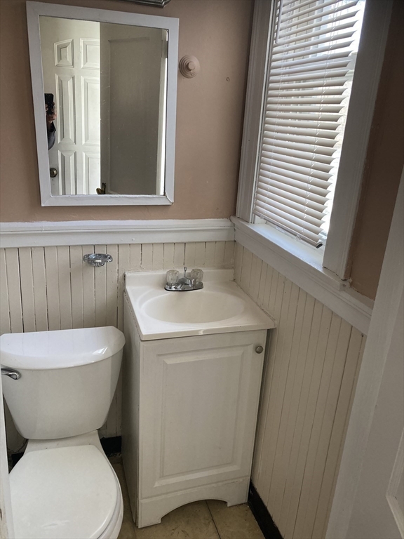 427 North Main Street Randolph, MA 02368 - Photo 11 of 23 a bathroom with a toilet sink and mirror