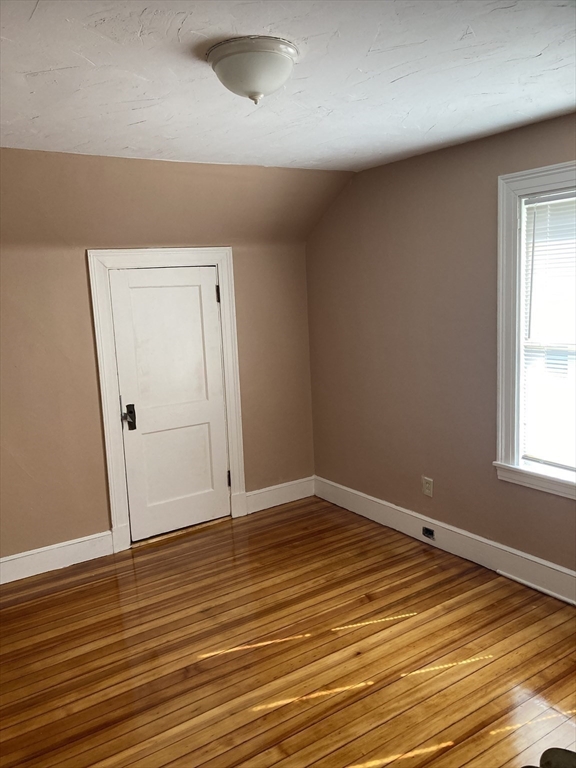 427 North Main Street Randolph, MA 02368 - Photo 15 of 23 an empty room with wooden floor and windows