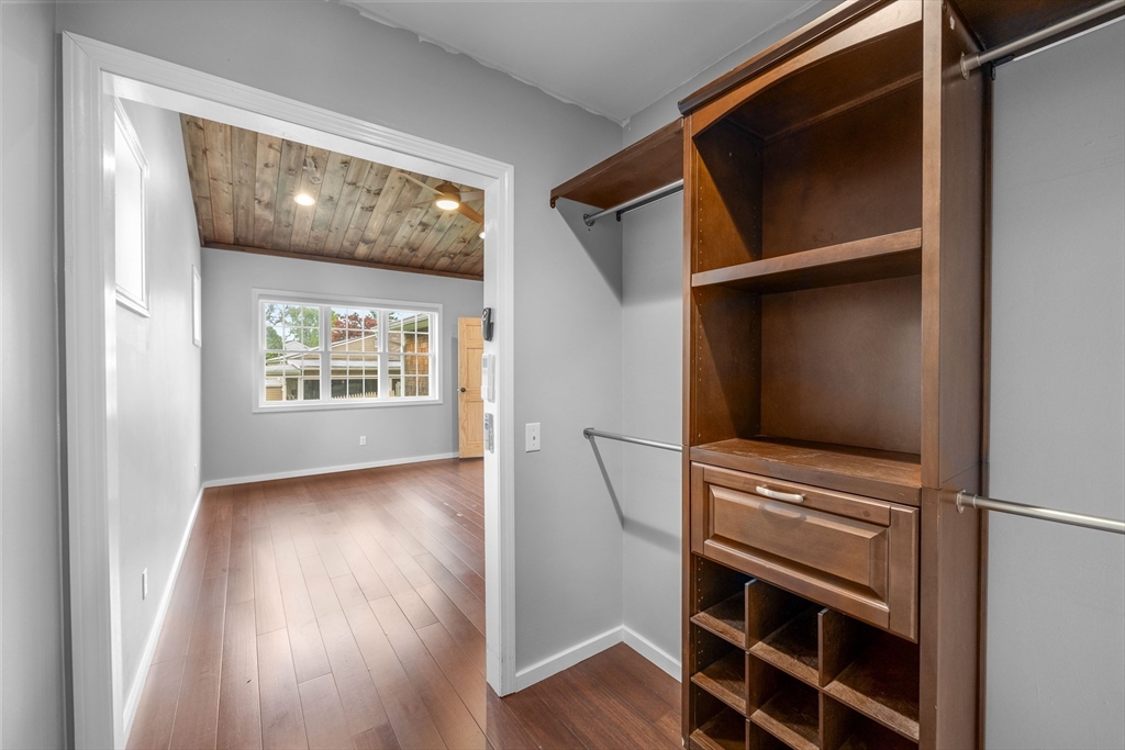 46 Wing Lane Acushnet, MA 02743 - Photo 14 of 38 a view of an empty room with wooden floor kitchen view and windows