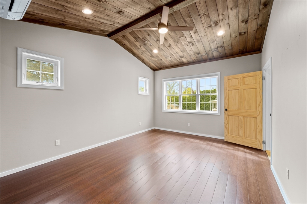 46 Wing Lane Acushnet, MA 02743 - Photo 15 of 38 a view of an empty room with wooden floor and a window
