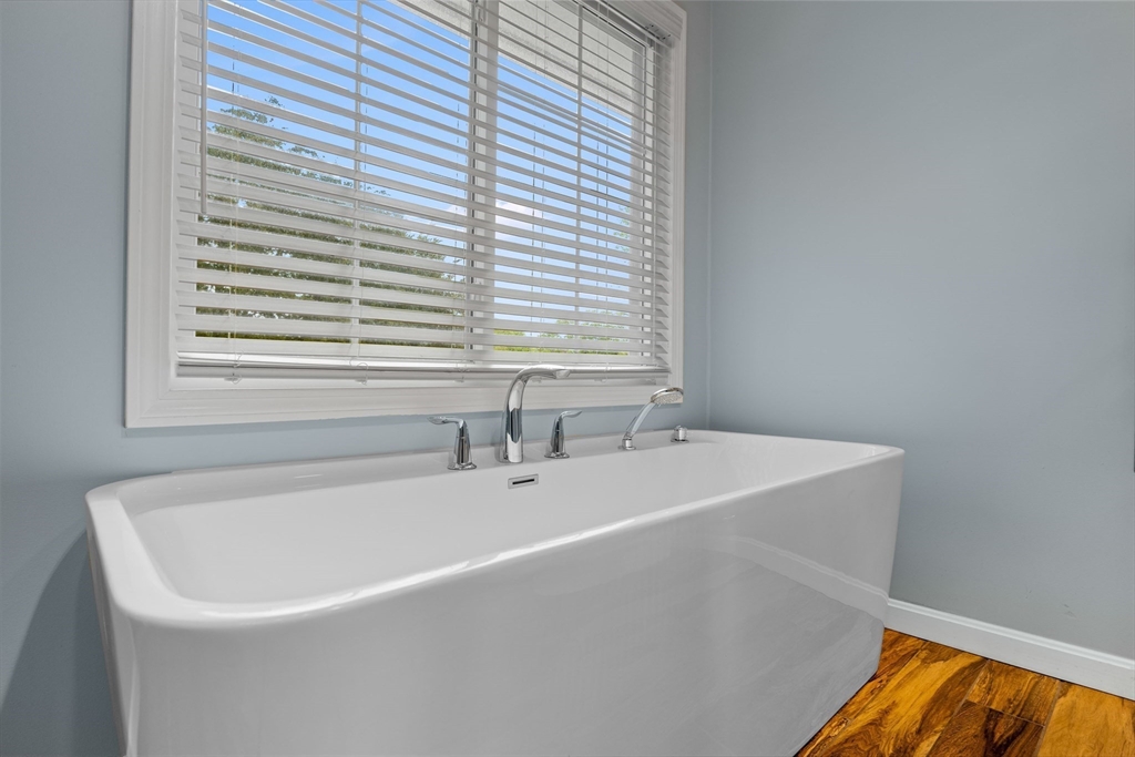 46 Wing Lane Acushnet, MA 02743 - Photo 17 of 38 a white bath tub sitting in a bathroom