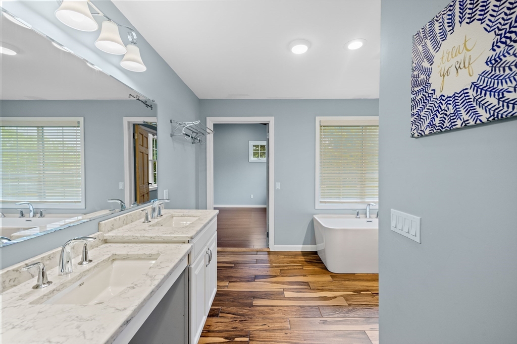 46 Wing Lane Acushnet, MA 02743 - Photo 19 of 38 a spacious bathroom with a granite countertop sink mirror and toilet