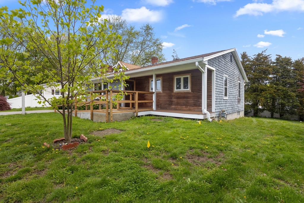 46 Wing Lane Acushnet, MA 02743 - Photo 2 of 38 a backyard of a house with lots of green space