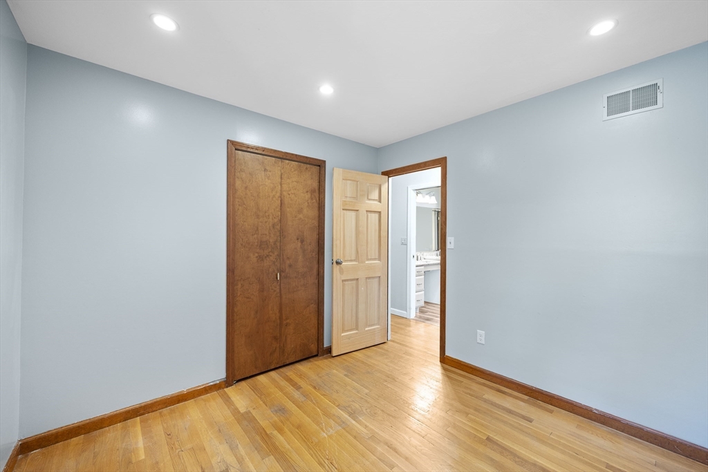 46 Wing Lane Acushnet, MA 02743 - Photo 25 of 38 a view of an empty room with wooden floor