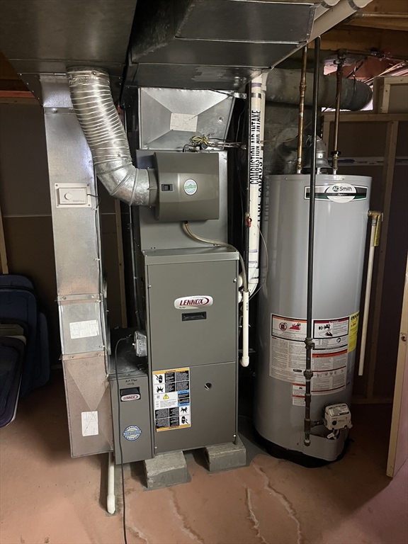 46 Wing Lane Acushnet, MA 02743 - Photo 30 of 38 a view of a storage room with washer and dryer