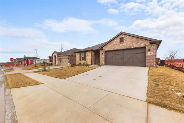 a house view with a wooden fence