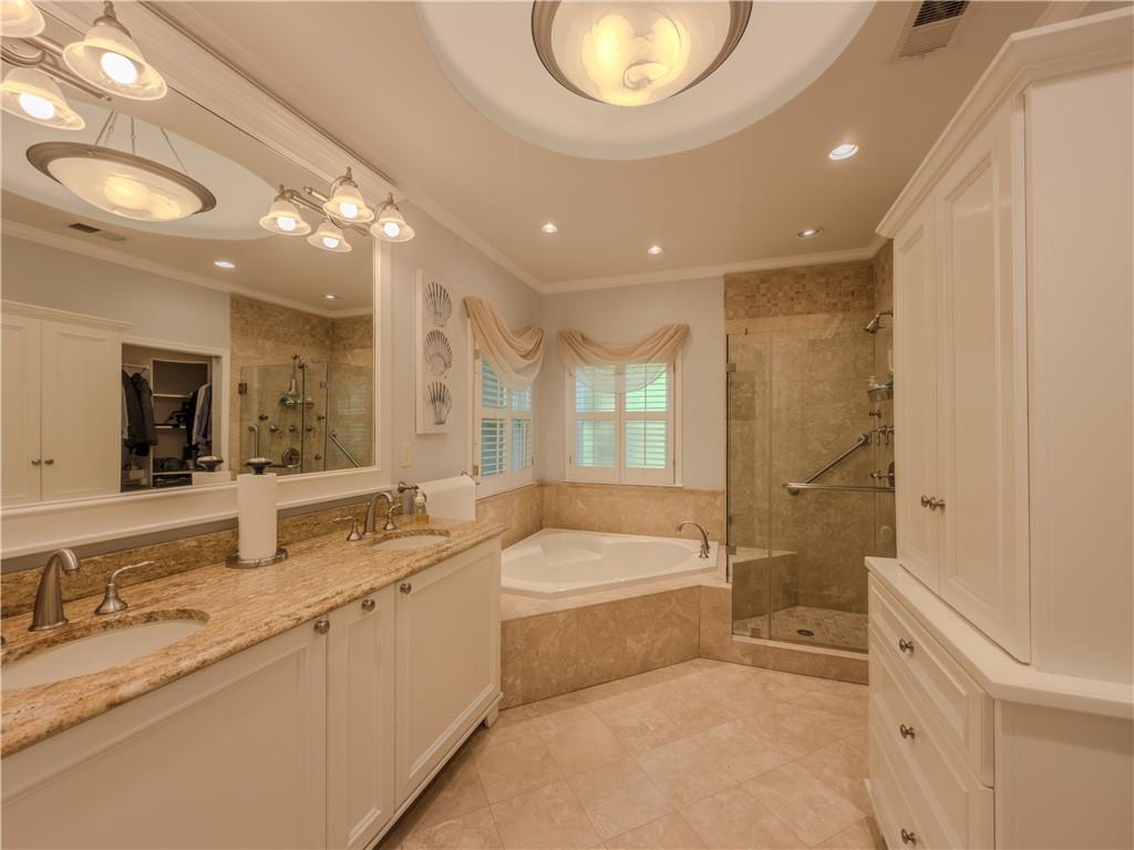 4284 Cedar Bluff Way Southwest Lilburn, GA 30047 - Photo 13 of 62 a bathroom with a granite countertop sink mirror bathtub and toilet