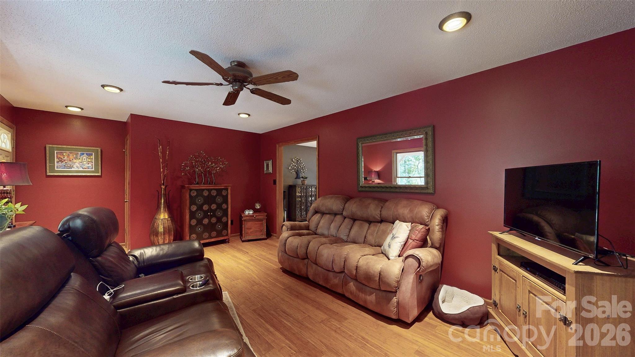 8720 Unionville-Brief Road Monroe, NC 28110 - Photo 23 of 35 a living room with furniture and a flat screen tv